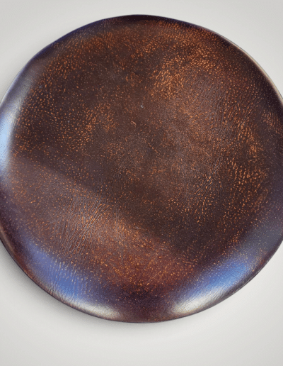CBK Round Tooled Leather-Look Drum Ottoman with Embossed Scrollwork